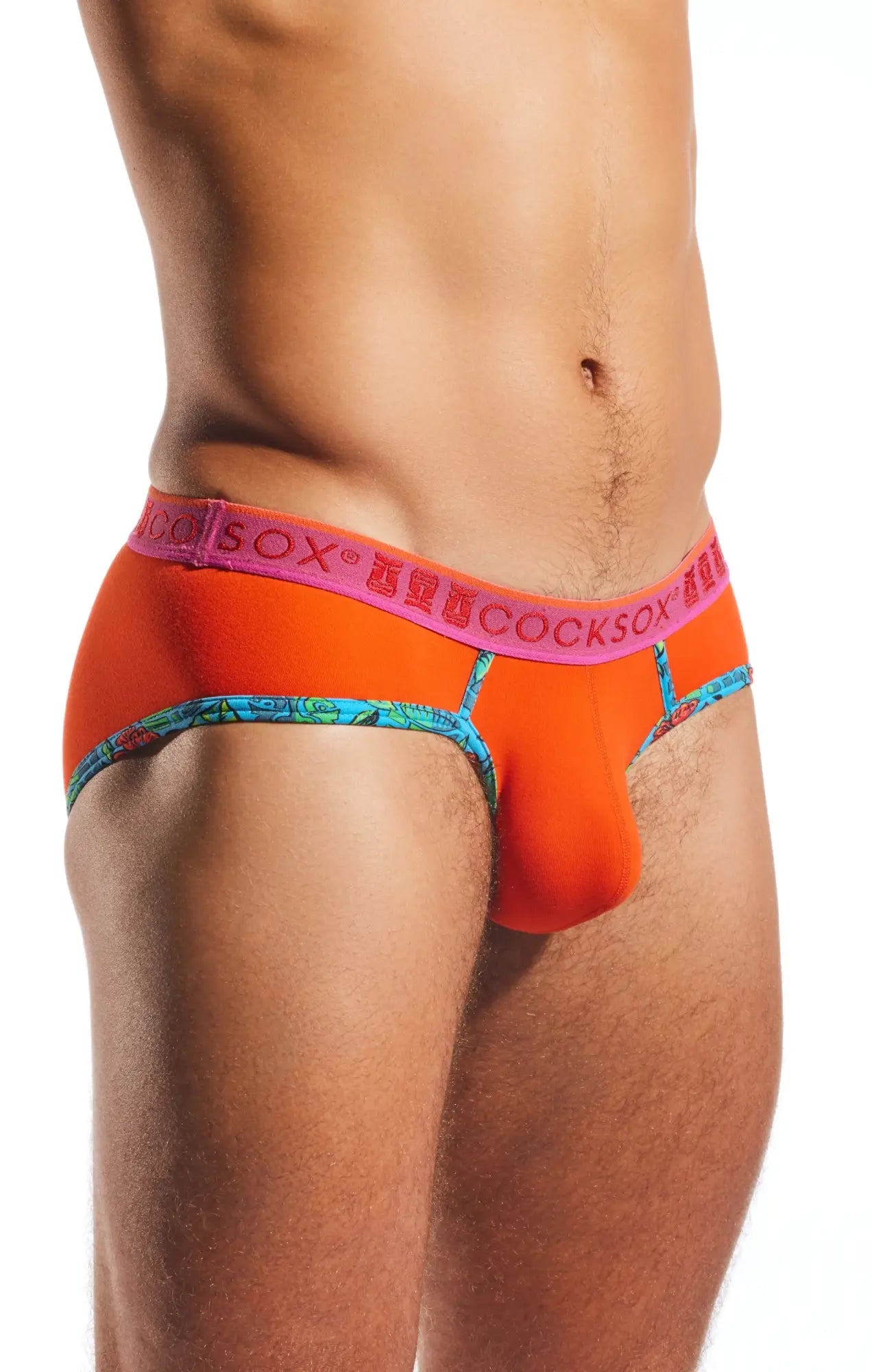Bright orange cocksox cx76n sports briefs with pink branded waistband and turquoise patterned trim