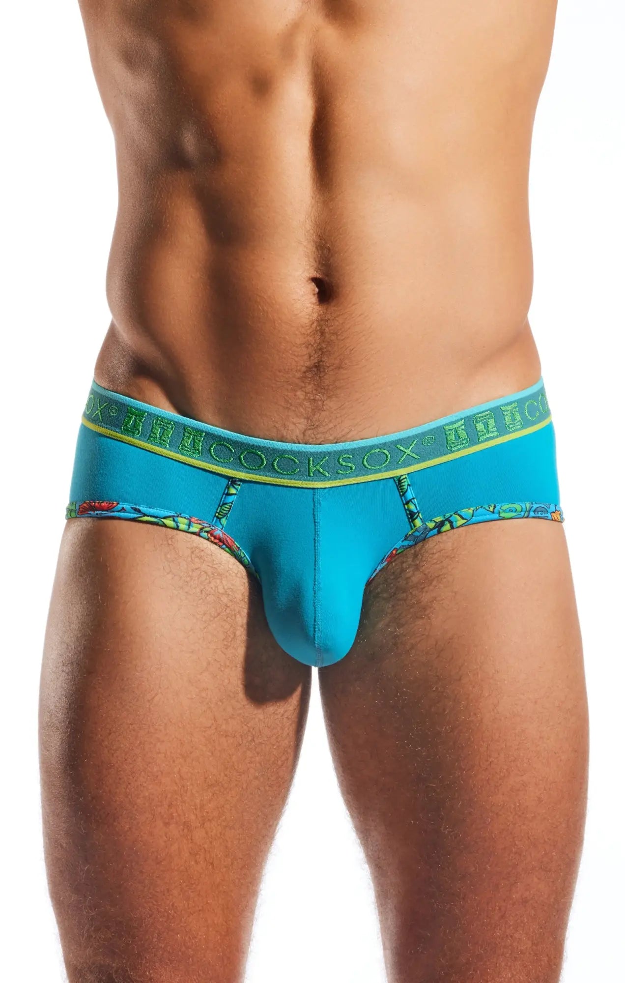 Cocksox cx76n sports brief in bright turquoise with green patterned waistband and colorful tropical leg print