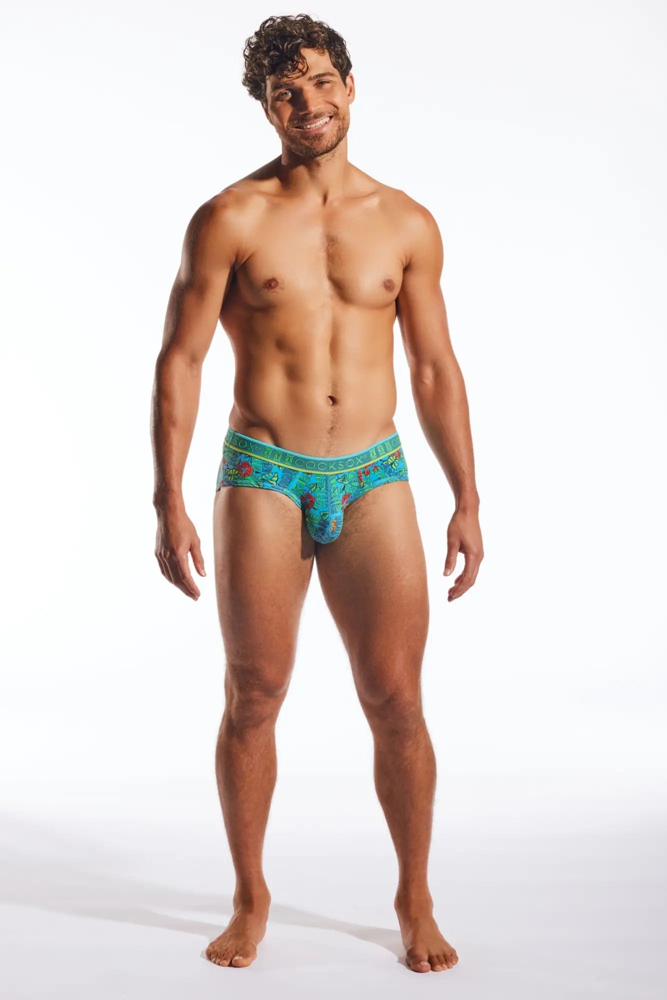 Turquoise patterned men’s Cocksox CX76N sports briefs with floral design and stretchy fabric for active wear