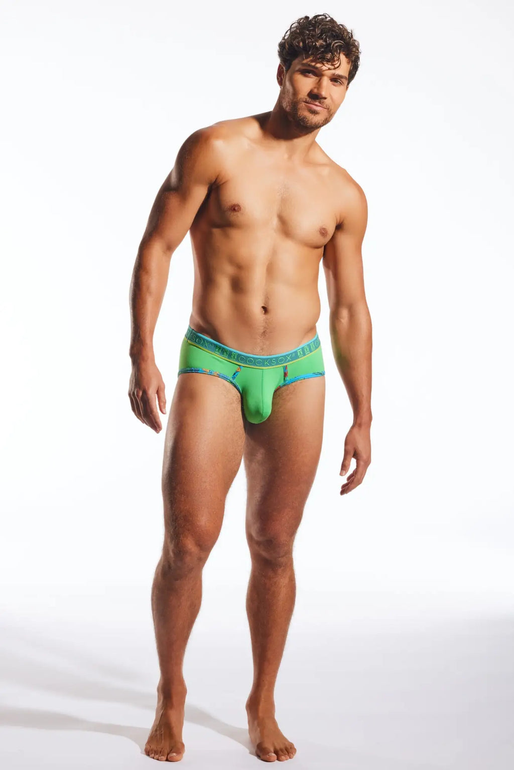 Vibrant green cocksox cx76n sports brief with teal waistband and subtle branding designed for active wear