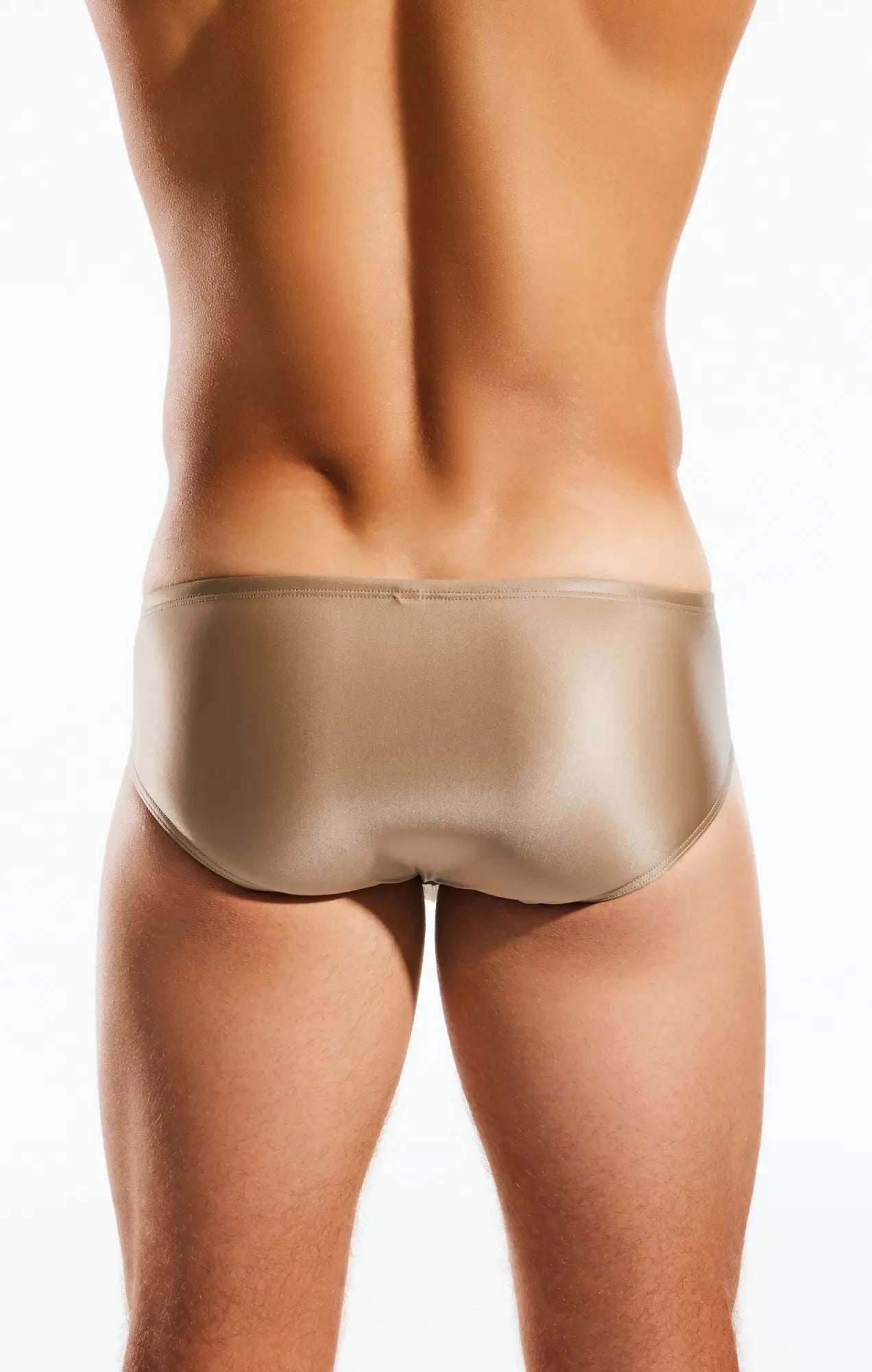 A sleek metallic gold satin Cocksox CX79GS boy leg swim brief with smooth glossy finish and snug fit