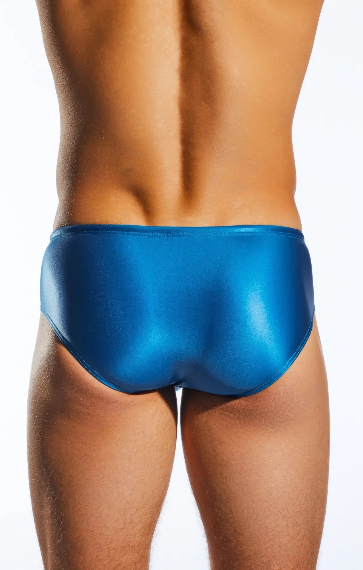 Vibrant blue glossy cocksox cx79gs boy leg swim brief with sleek form-fitting design for swimming and beachwear