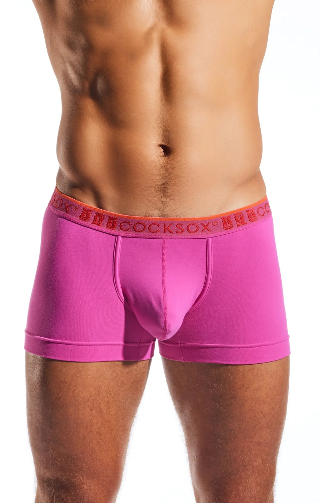 Bright pink cocksox cx94 men’s boxer briefs with orange waistband and hercosox red brand lettering