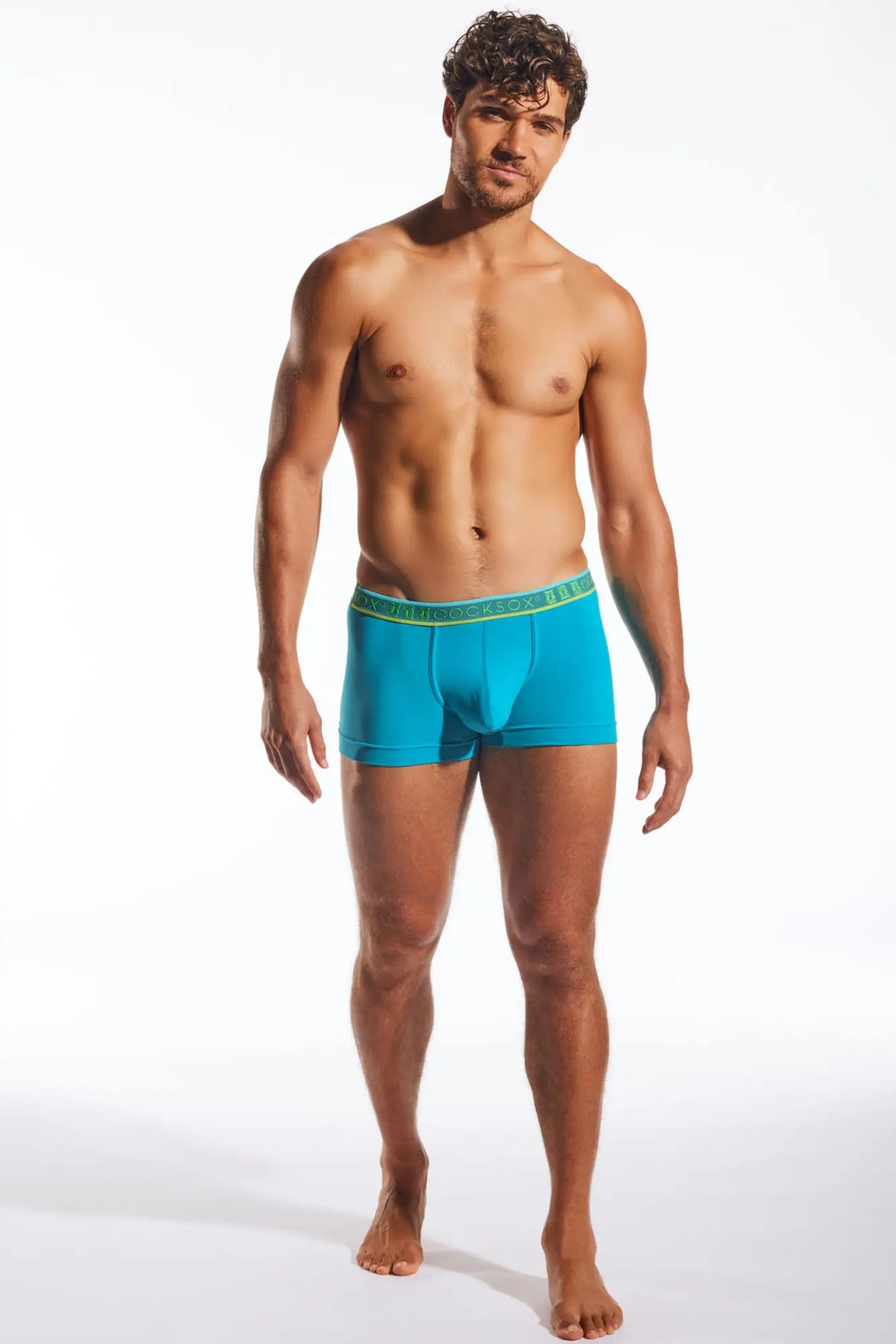 Turquoise blue cocksox cx94 boxer brief with green elastic waistband and branded logo for men