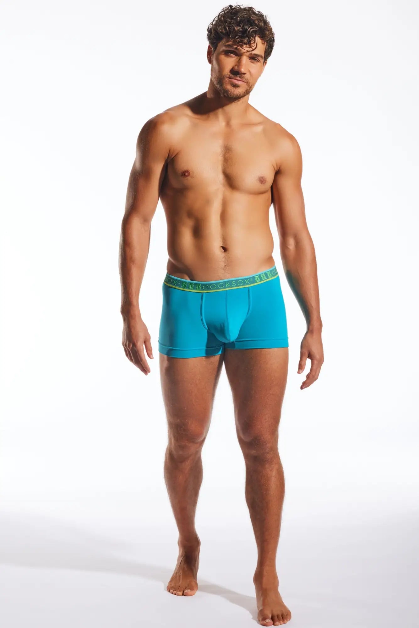 Turquoise blue cocksox cx94 boxer brief with green elastic waistband and branded logo for men