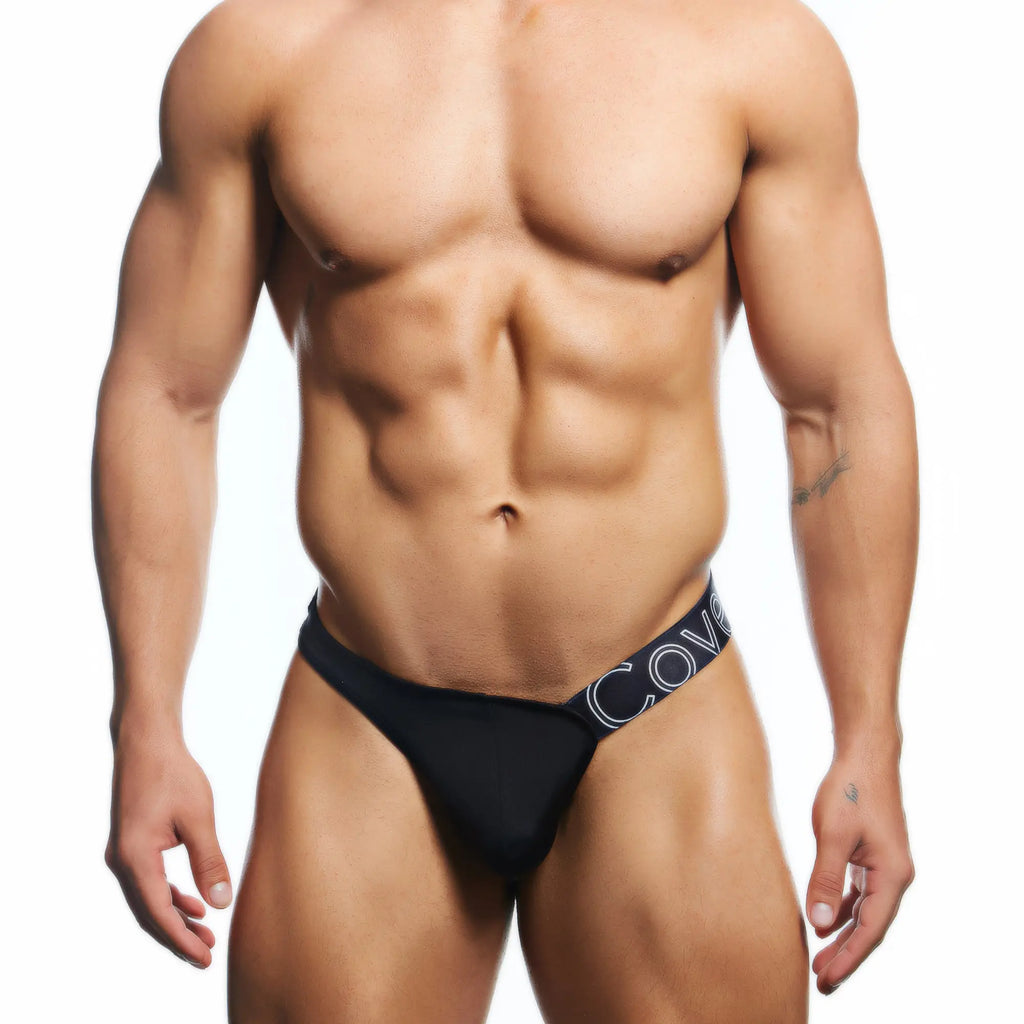 Black menâ€™s briefs with navy blue waistband and white lettering from cover male cmk083 thong collection