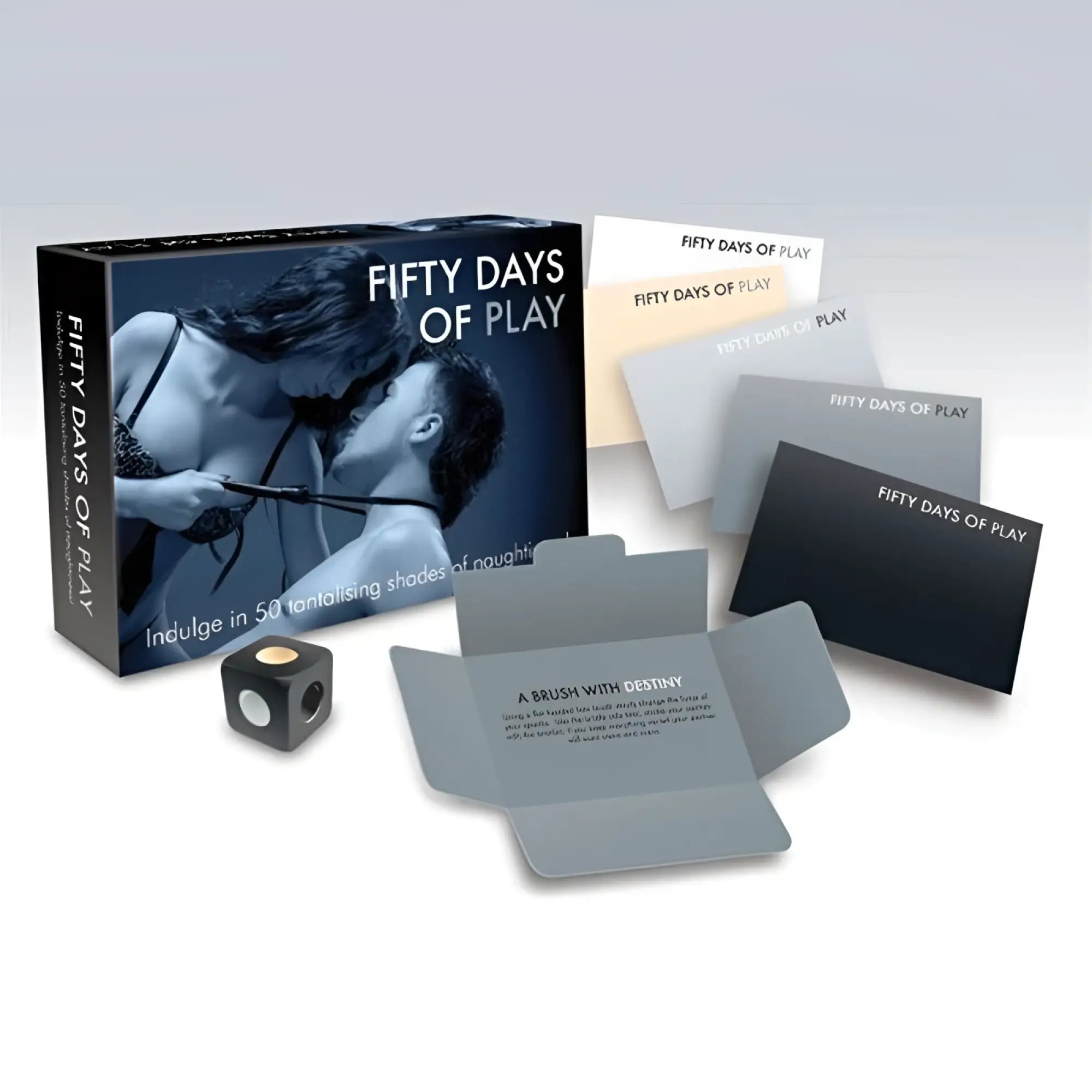The fifty days of play game box in dark blue features an intimate embrace and includes gray silicone items for couples play