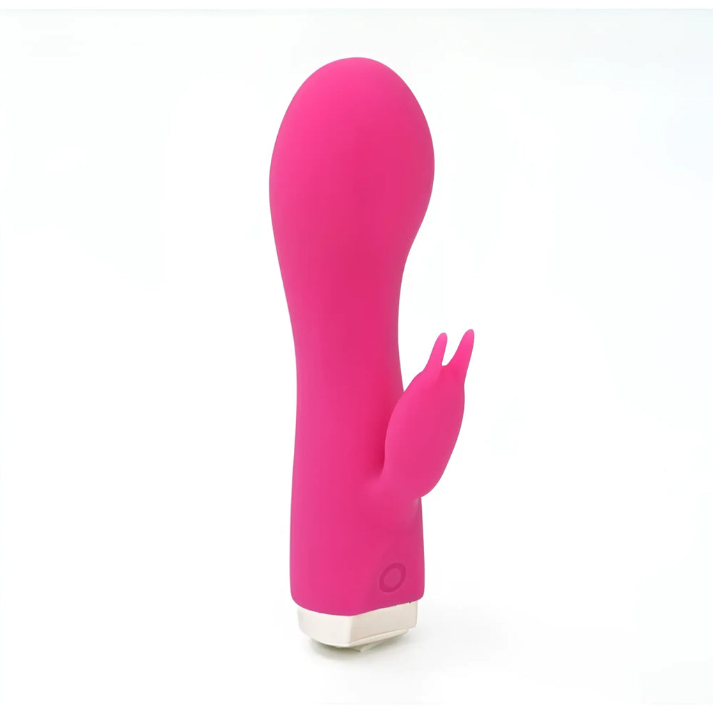 Vibrant pink silicone rabbit-shaped vibrator with smooth rounded body and small white base from CreativeC Skins Minis Bijou Bunny