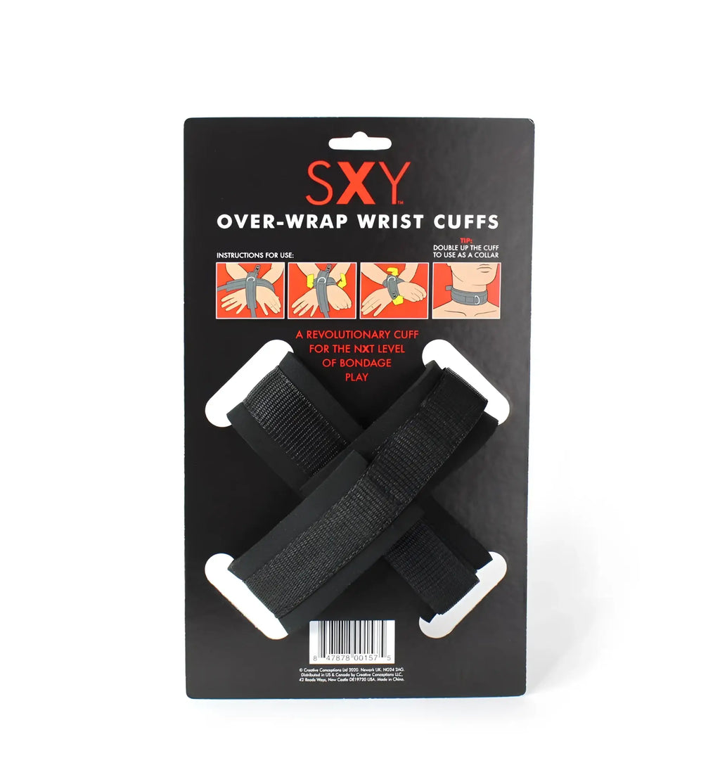 Black CreativeC SXY cuffs over-wrap wrist cuffs with white plastic ends on a black cardboard display card