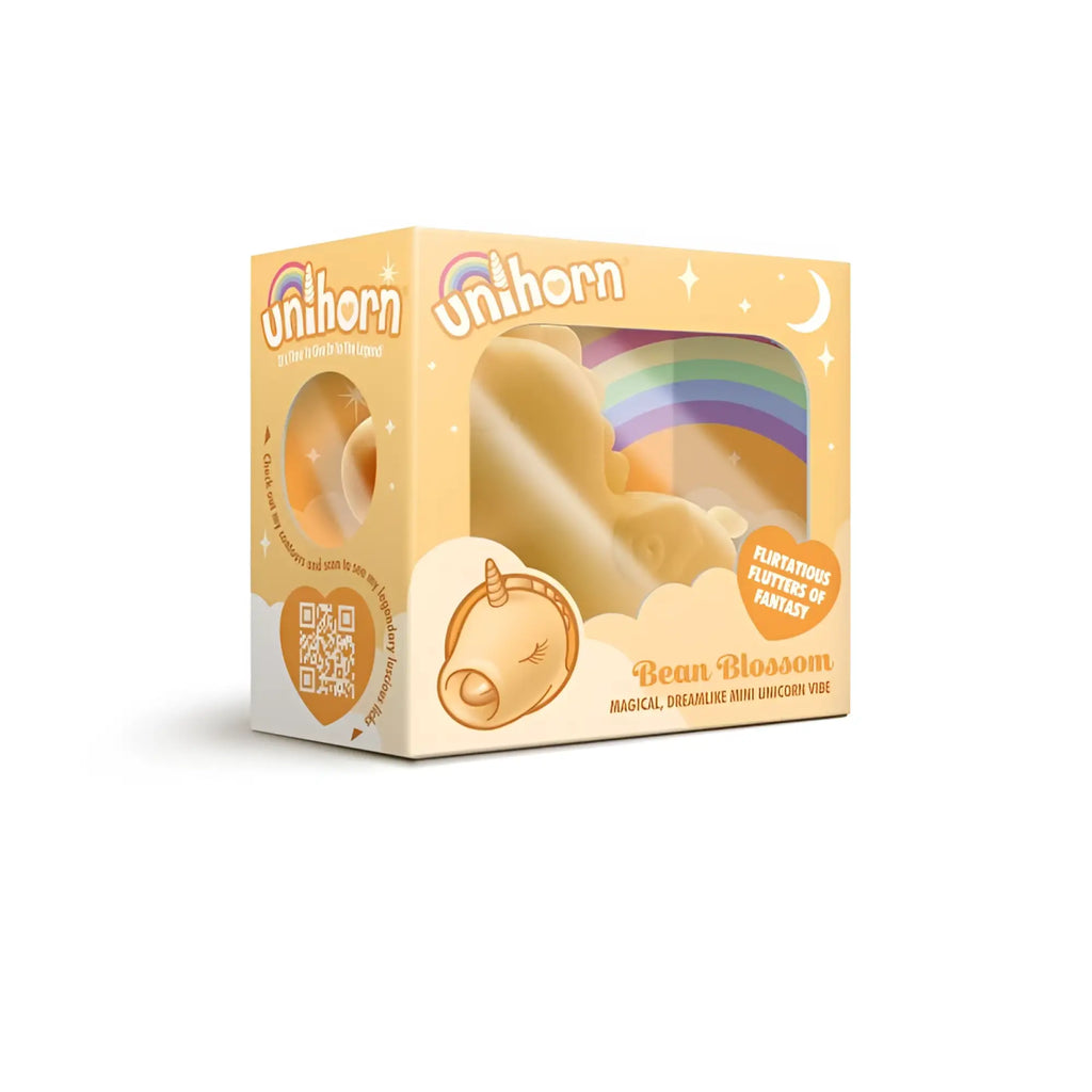 CreativeC unihorn bean blossom vibe soft cream-colored unicorn-shaped bean bag with rainbow design and closed eyes