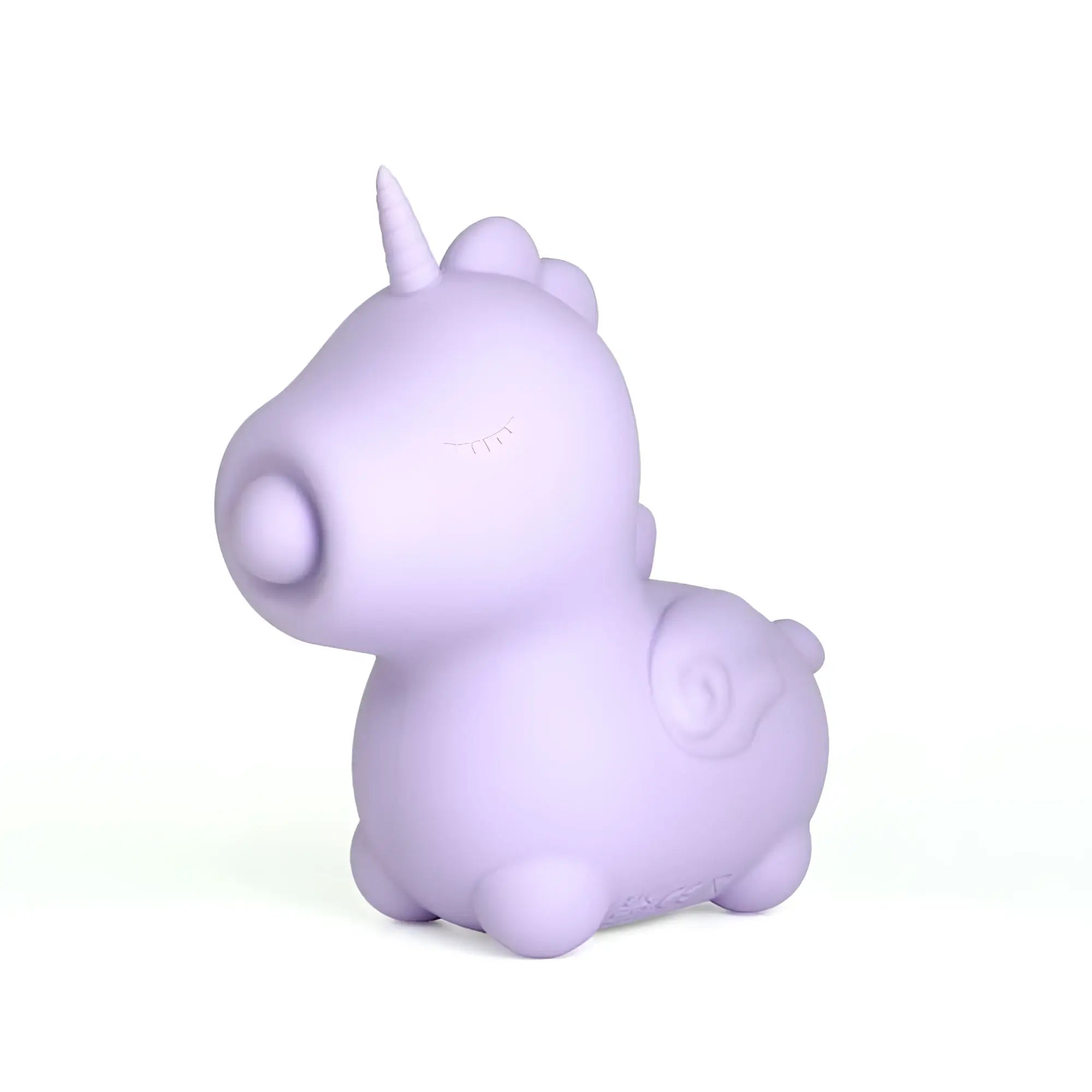 A soft lavender silicone unicorn figurine with a rounded plush design and small horn from creativec unihorn karma lilac