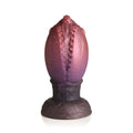 Creature Cocks Dragon Hatch silicone egg shaped candle with gradient purple pink speckled textured ridged surface