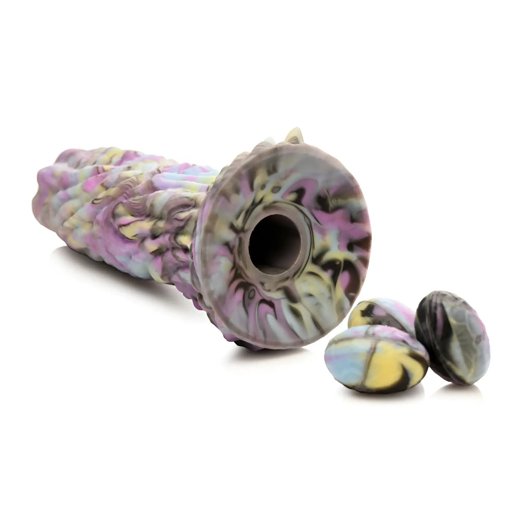 A marbled silicone massage roller with pink purple yellow and gray hues in the Creature Cocks Dragon Spawn dildo