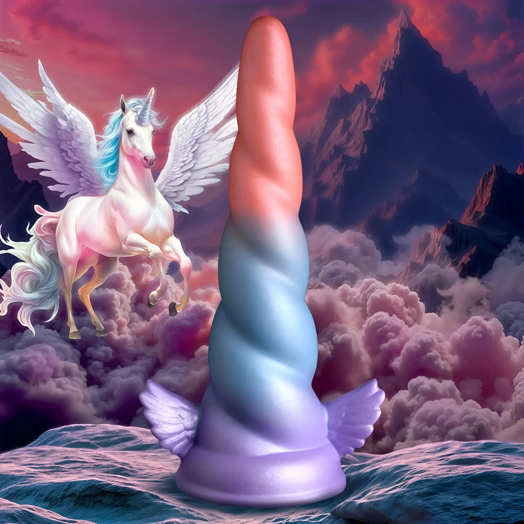 Creature Cocks Dream Rider silicone dildo shaped like a unicorn horn with pink blue purple gradient and wings at the base