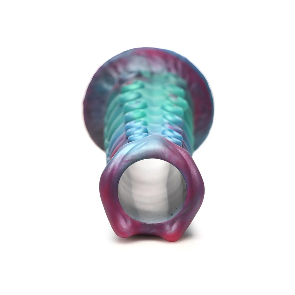 A vibrant gradient silicone dildo with textured grip and hollow cylindrical end from creature cocks galactic breeder series