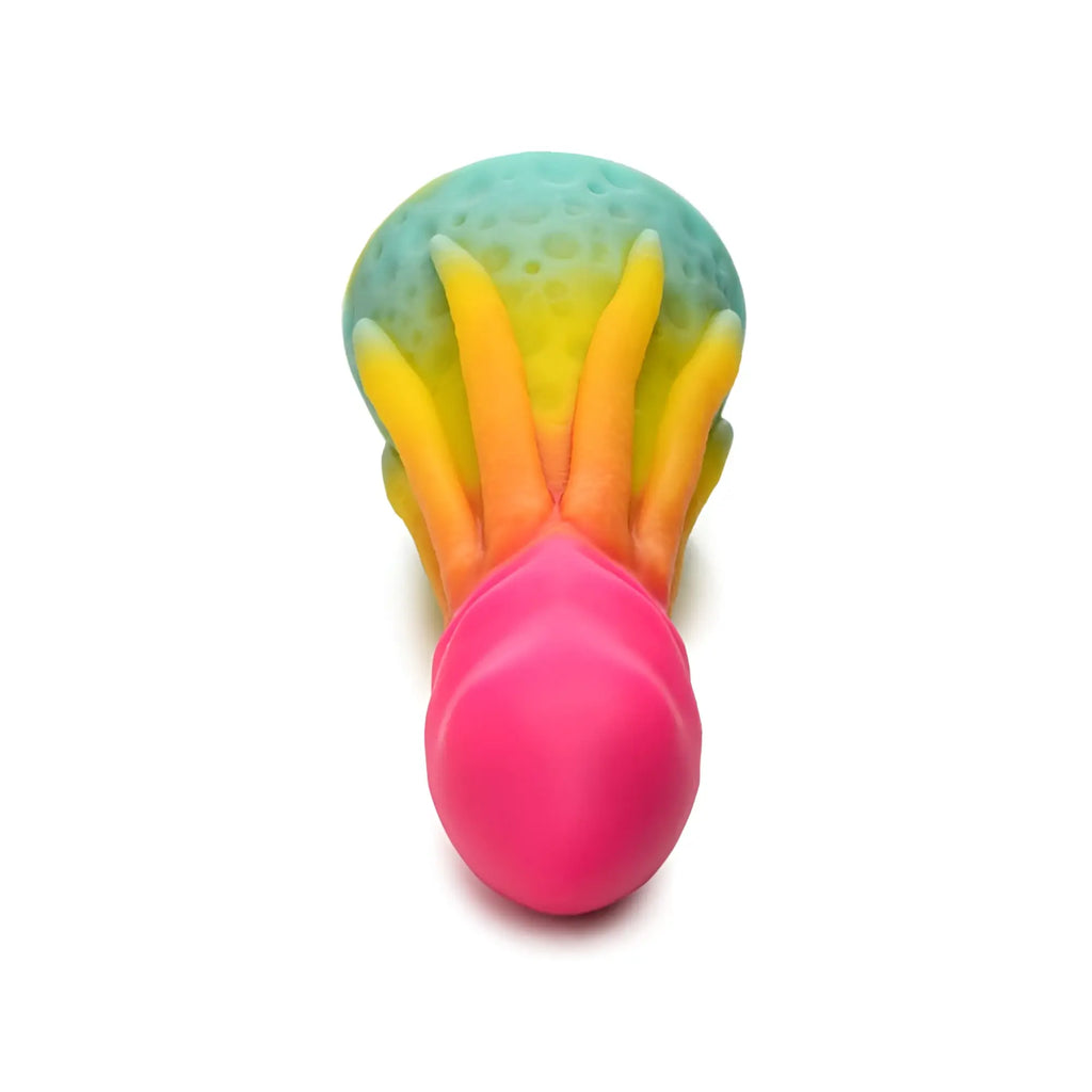 A vibrant rainbow-colored silicone king kraken dildo shaped like an octopus with a teal head and bright pink body