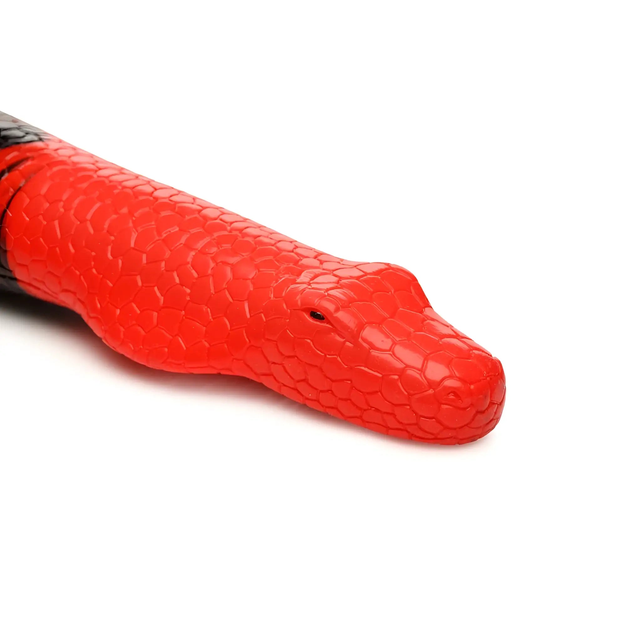 A vibrant red silicone king cobra toy with textured scales and black head markings from creature cocks large 14 inch line