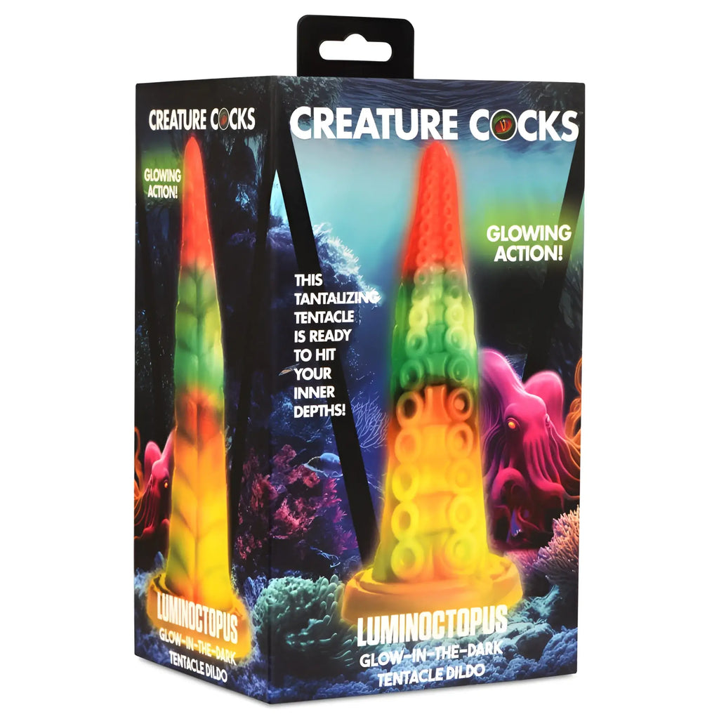 Luminous rainbow-colored glow in the dark octopus tentacle dildo in Creature Cocks branded packaging box