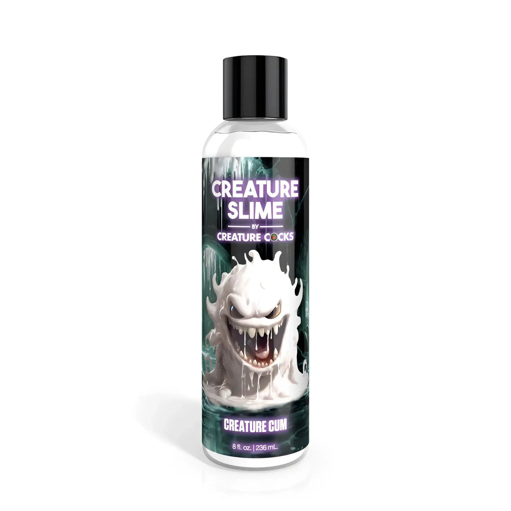 Clear plastic bottle with black cap of Creature Cocks Creature Slime unscented lubricant featuring white monster design