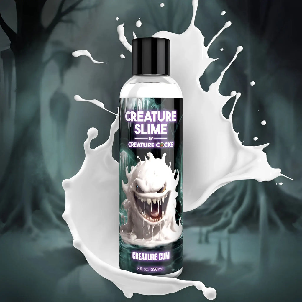 A clear plastic bottle with black cap containing unscented creature cocks creature slime lubricant 8oz with white monster label