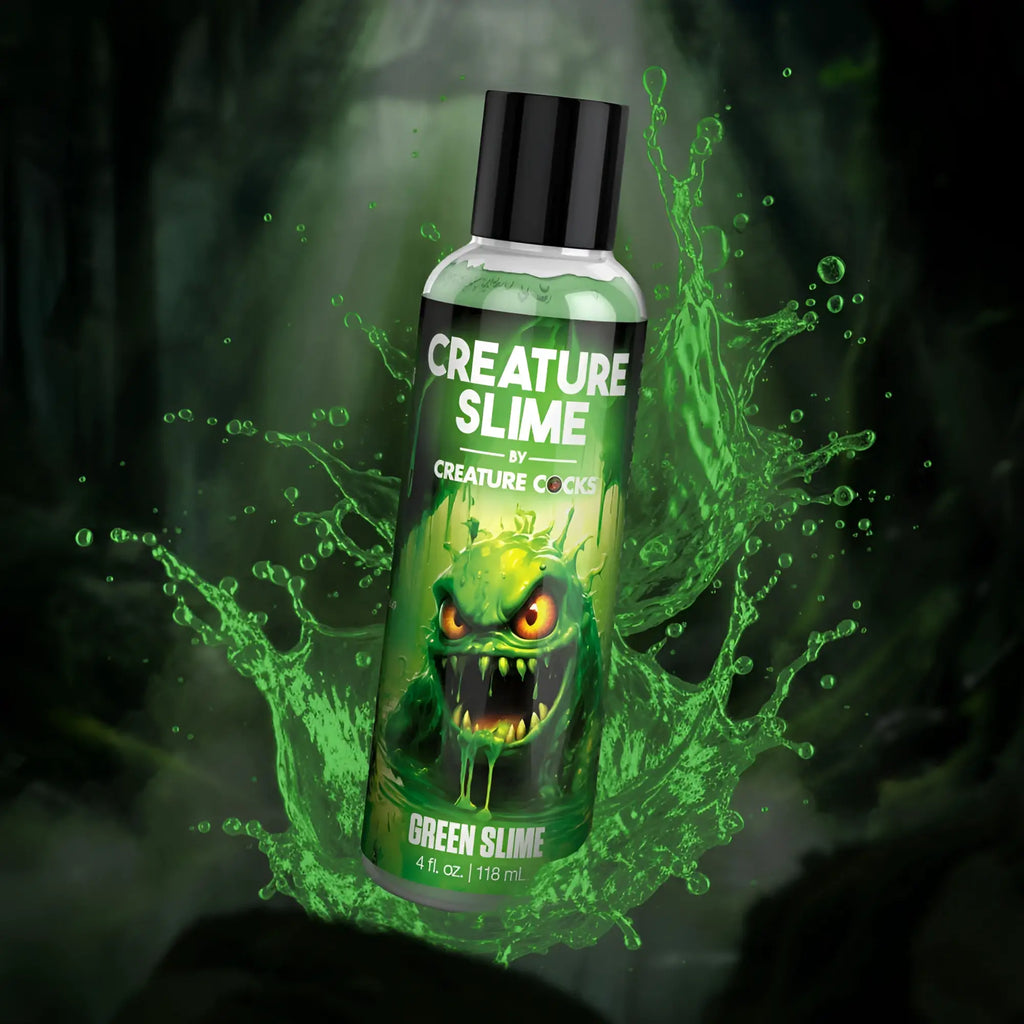 Green slime water based lubricant in a clear plastic bottle with black cap and creature cocks cartoon monster label