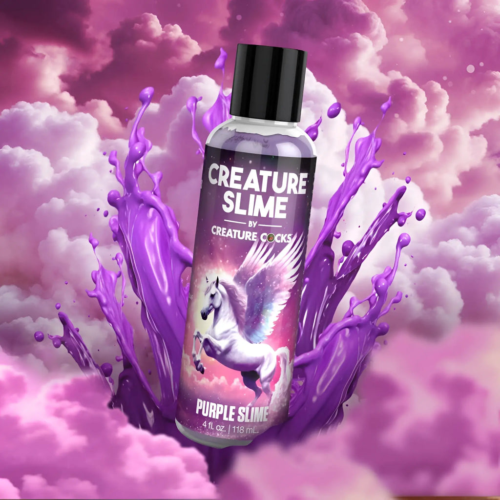 A clear plastic bottle with black cap containing purple Creature Cocks Creature slime water based lubricant 4oz