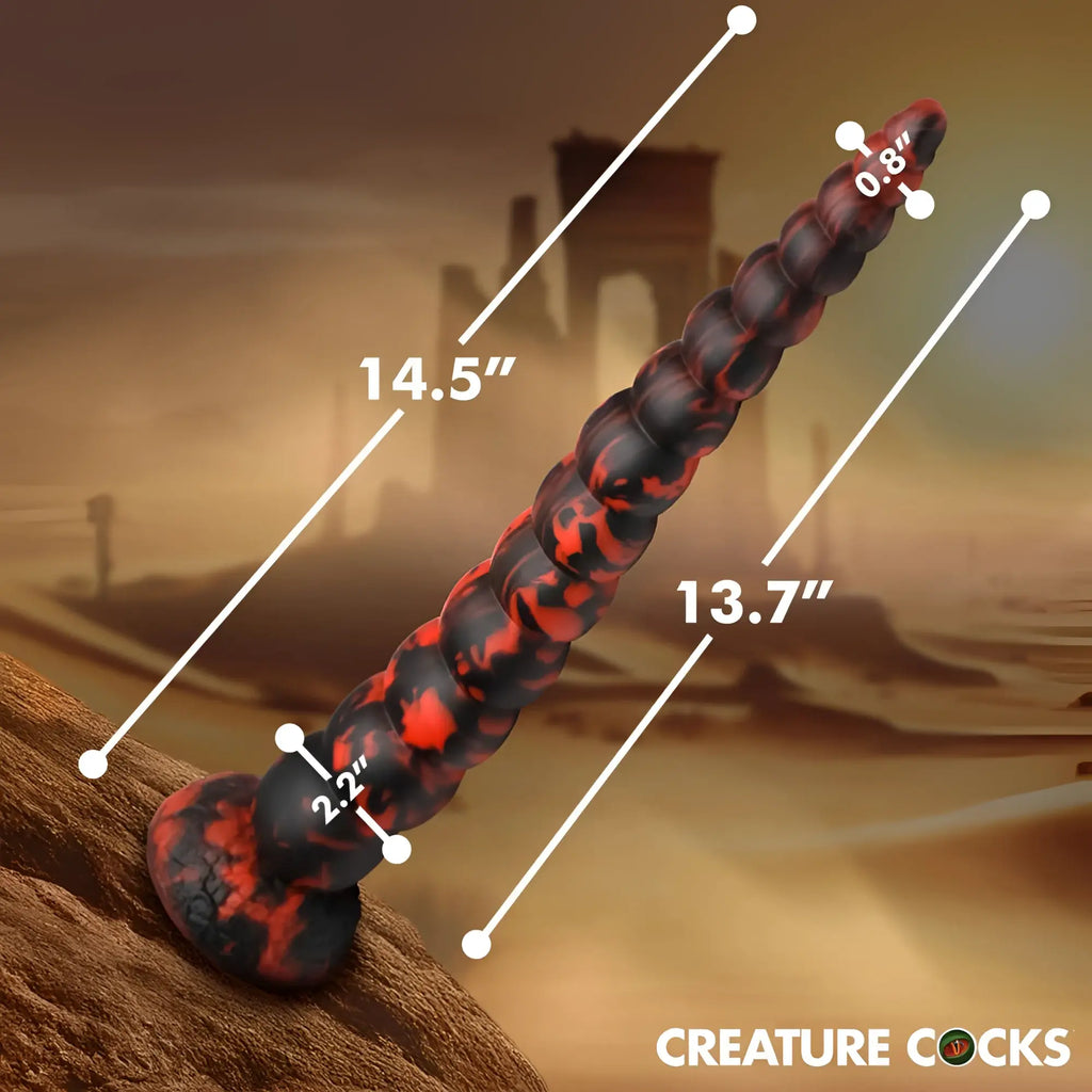A 14.5-inch black and red lava-patterned silicone cock ring with textured segmented design from creature cocks