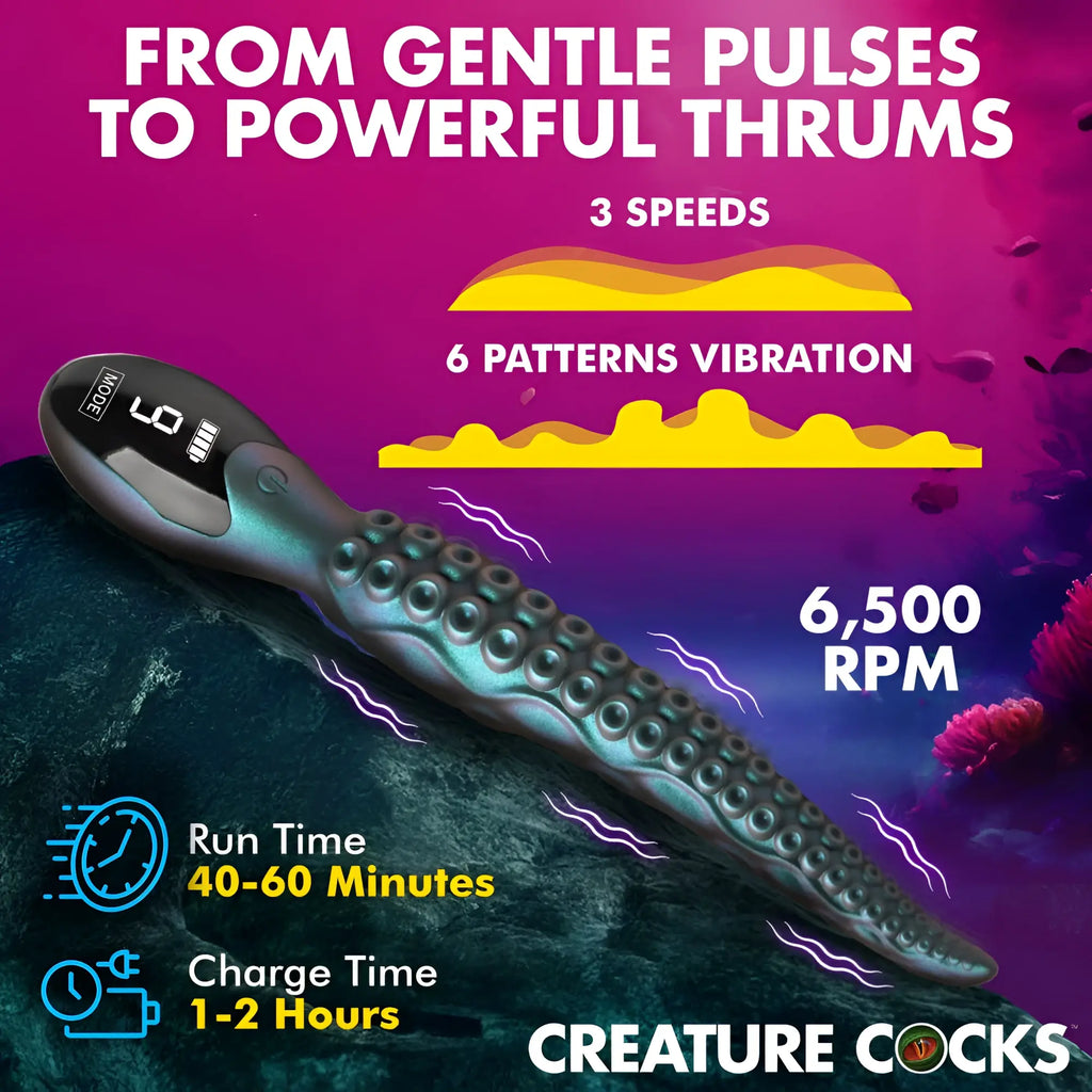 Creature cocks tentavibe silicone vibrator in dark teal and black shaped like an octopus with digital display showing low battery