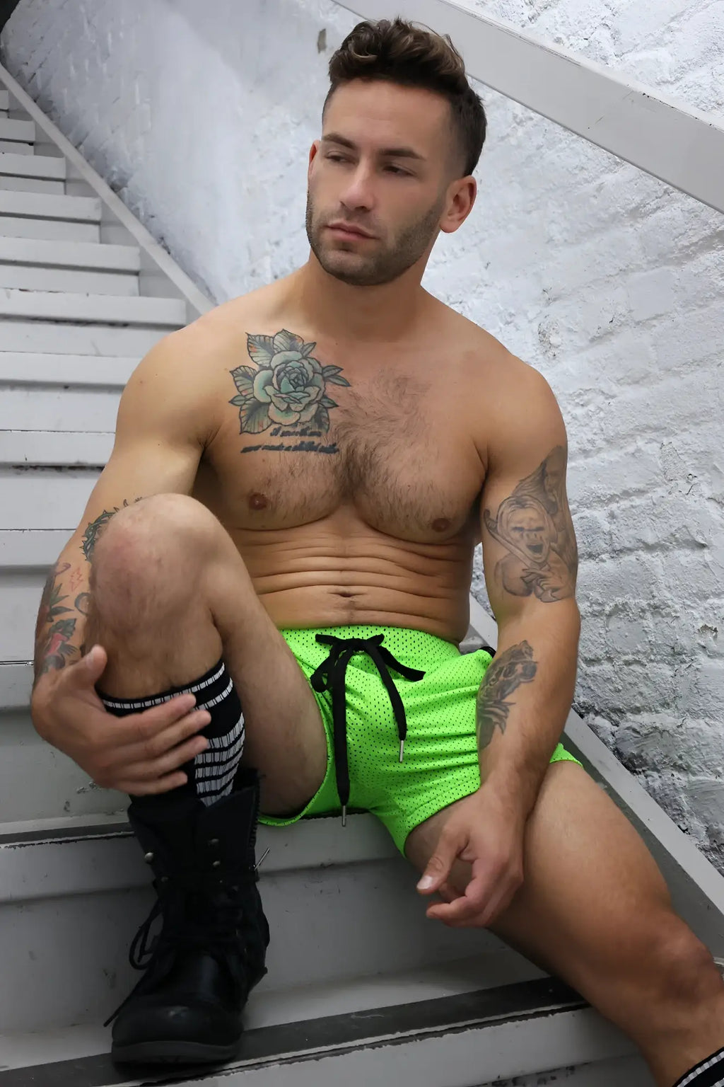 Neon green cruiser shorts in mesh fabric with black drawstring for casual and athletic wear