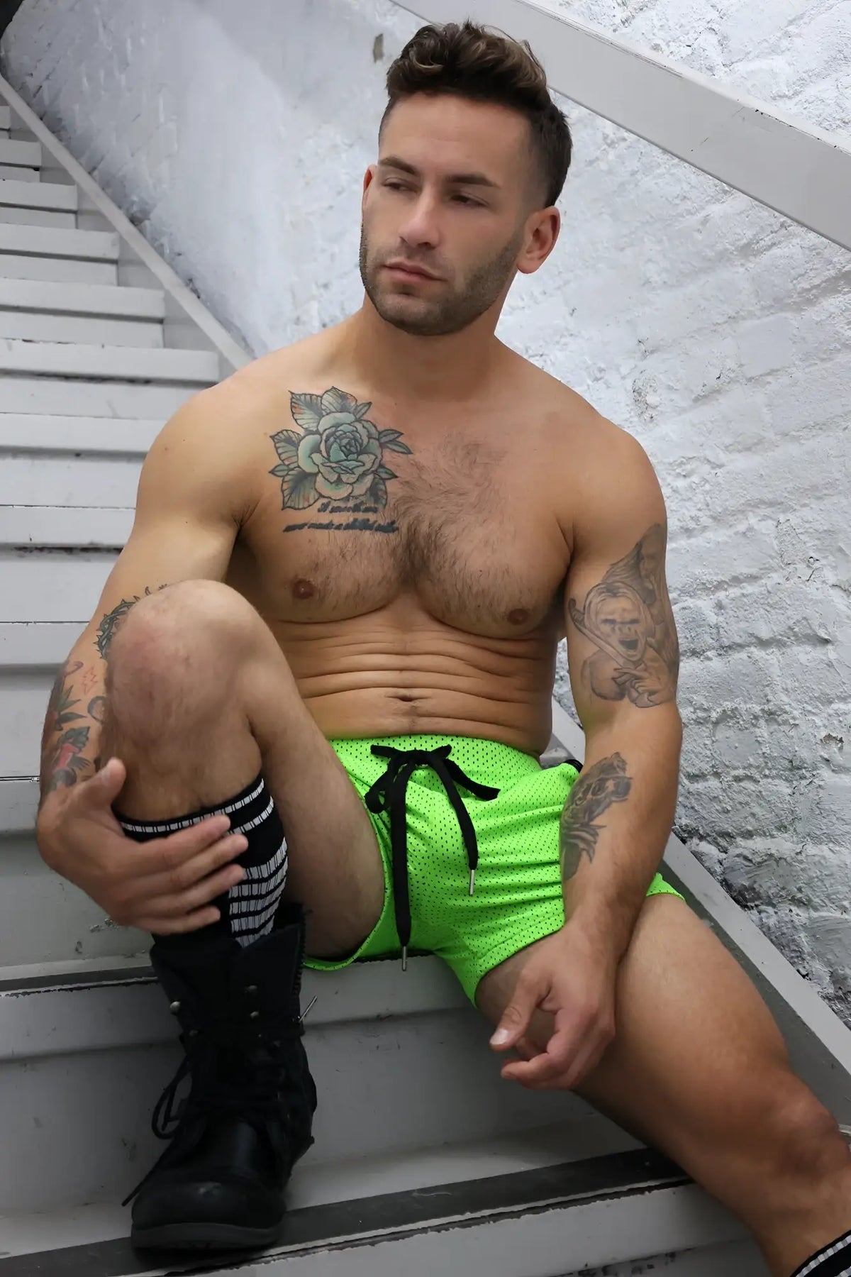 Neon green cruiser shorts in mesh fabric with black drawstring for casual and athletic wear