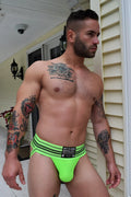 Bright neon green cumdump jock athletic briefs with black horizontal stripes and branded waistband label