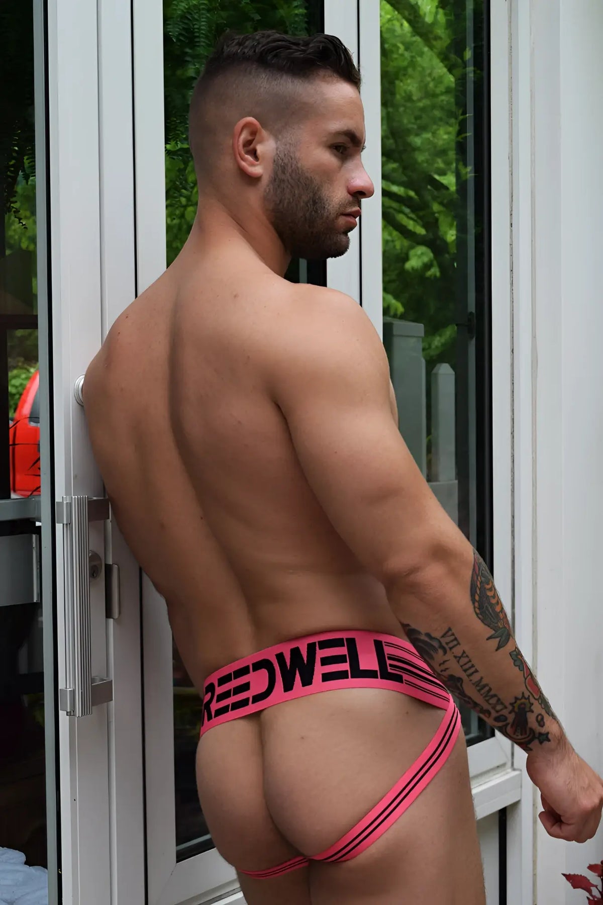 Pink and black cumdump jock briefs with bold modern design featuring neon pink accents for stylish support