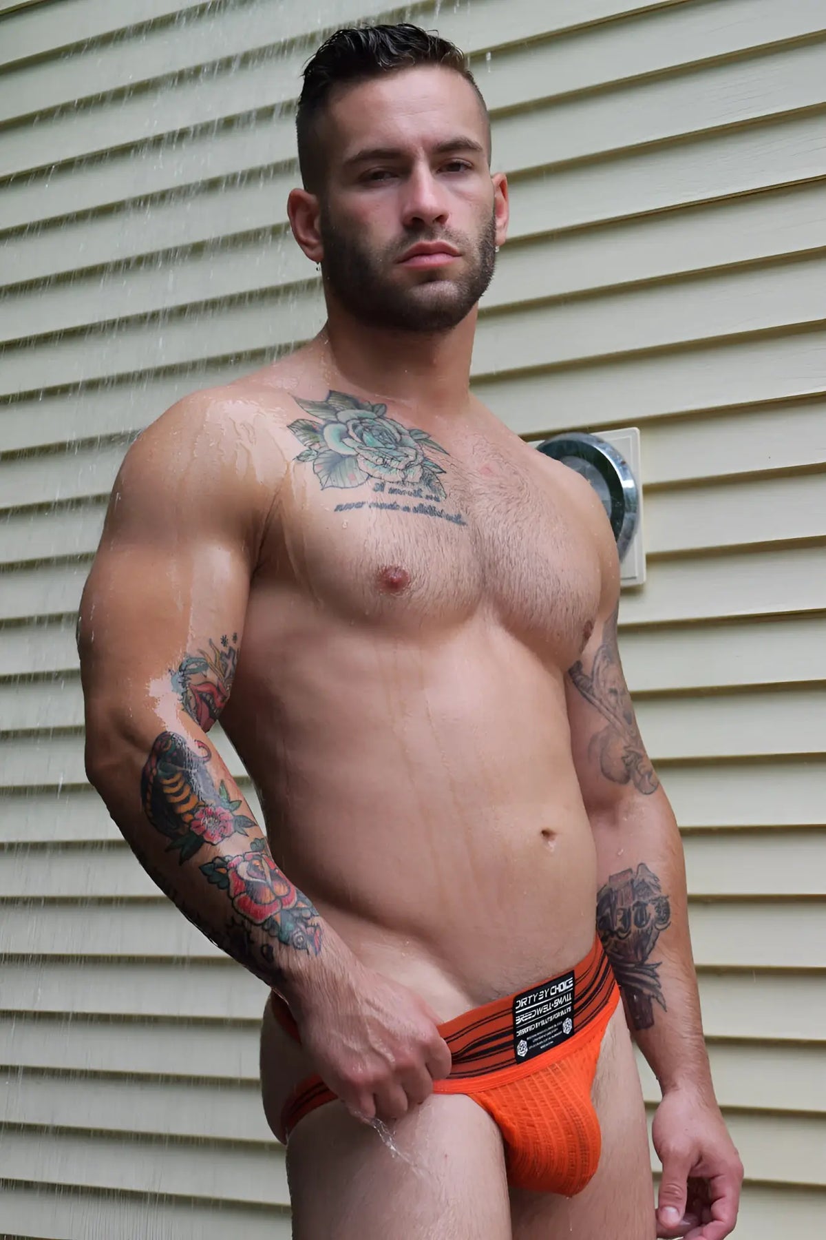 Orange textured briefs with black trim and branded waistband label from cumdump jock collection