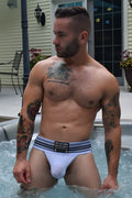 White briefs with a black and gray striped waistband featuring dirty by choice branding cumdump jock white