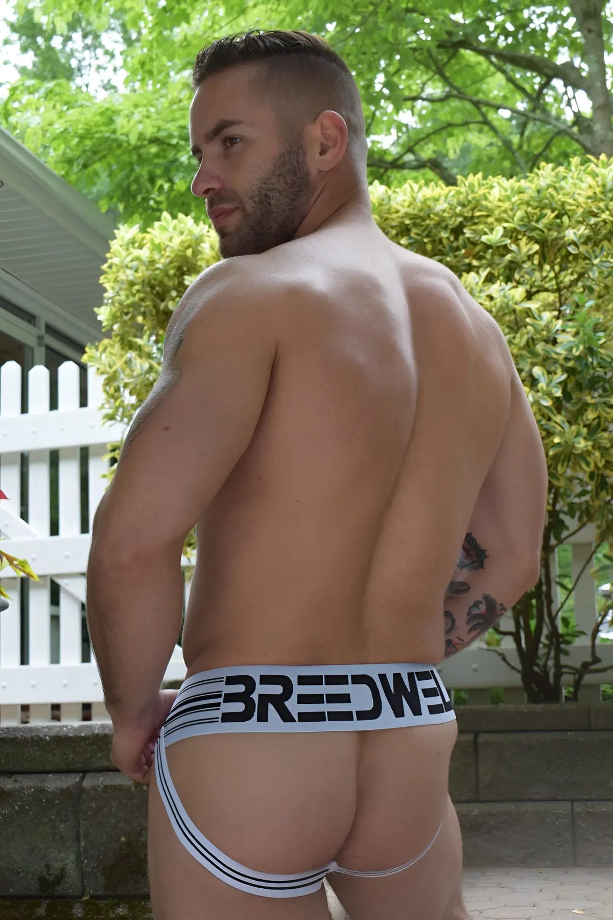 White breathable briefs cumdump jock with black breedwell branding and thin side stripes for comfortable wear