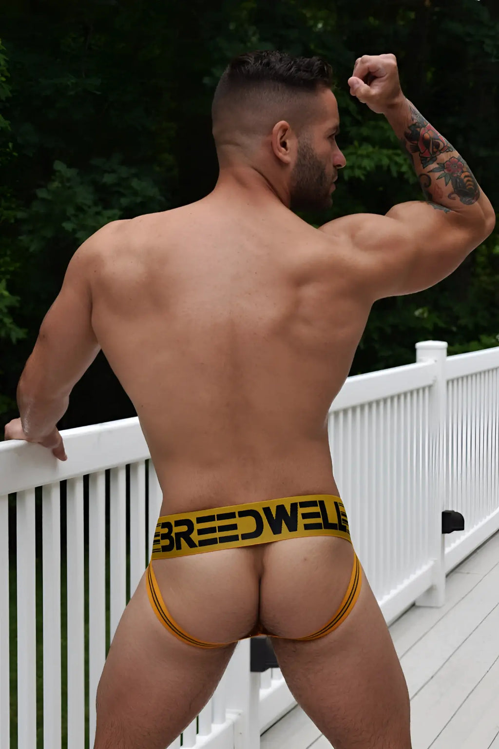 Yellow breedwell briefs with black lettering and thin side straps from the cumdump jock yellow collection