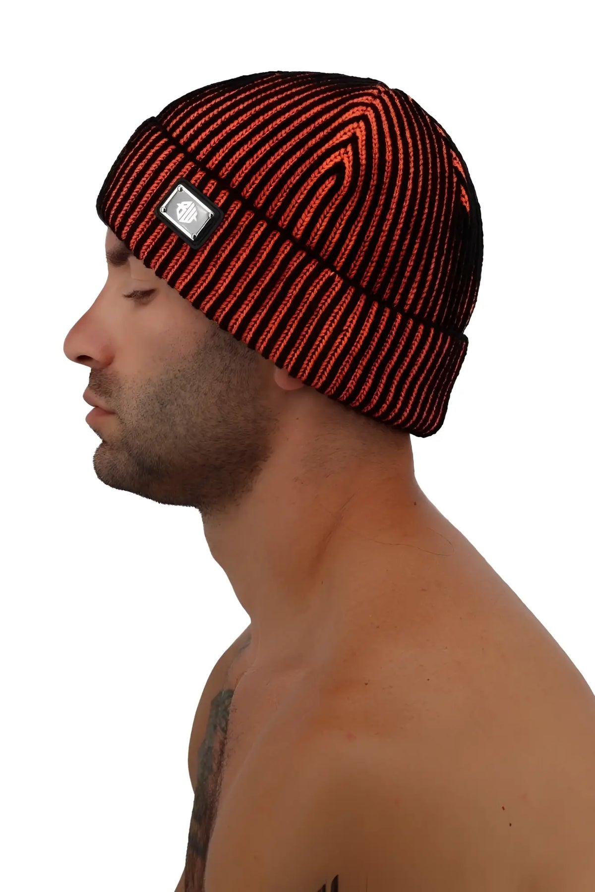 Darkroom rib beanie knitted with bold red and black vertical stripes and a small silver logo patch on the side