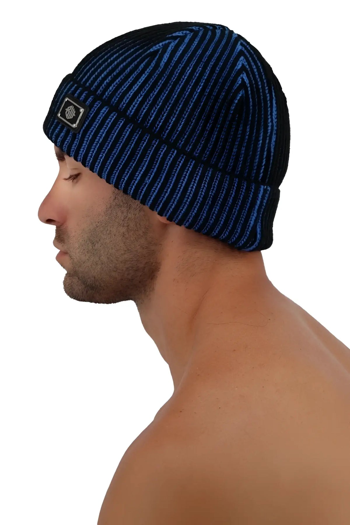 Darkroom rib beanie in navy blue and black ribbed knit with folded cuff and small rectangular logo patch on front