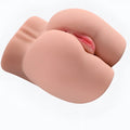 Pink silicone anal plug with realistic flesh tone texture and subtle internal detailing from daytona dolls bella butt torso masturbator