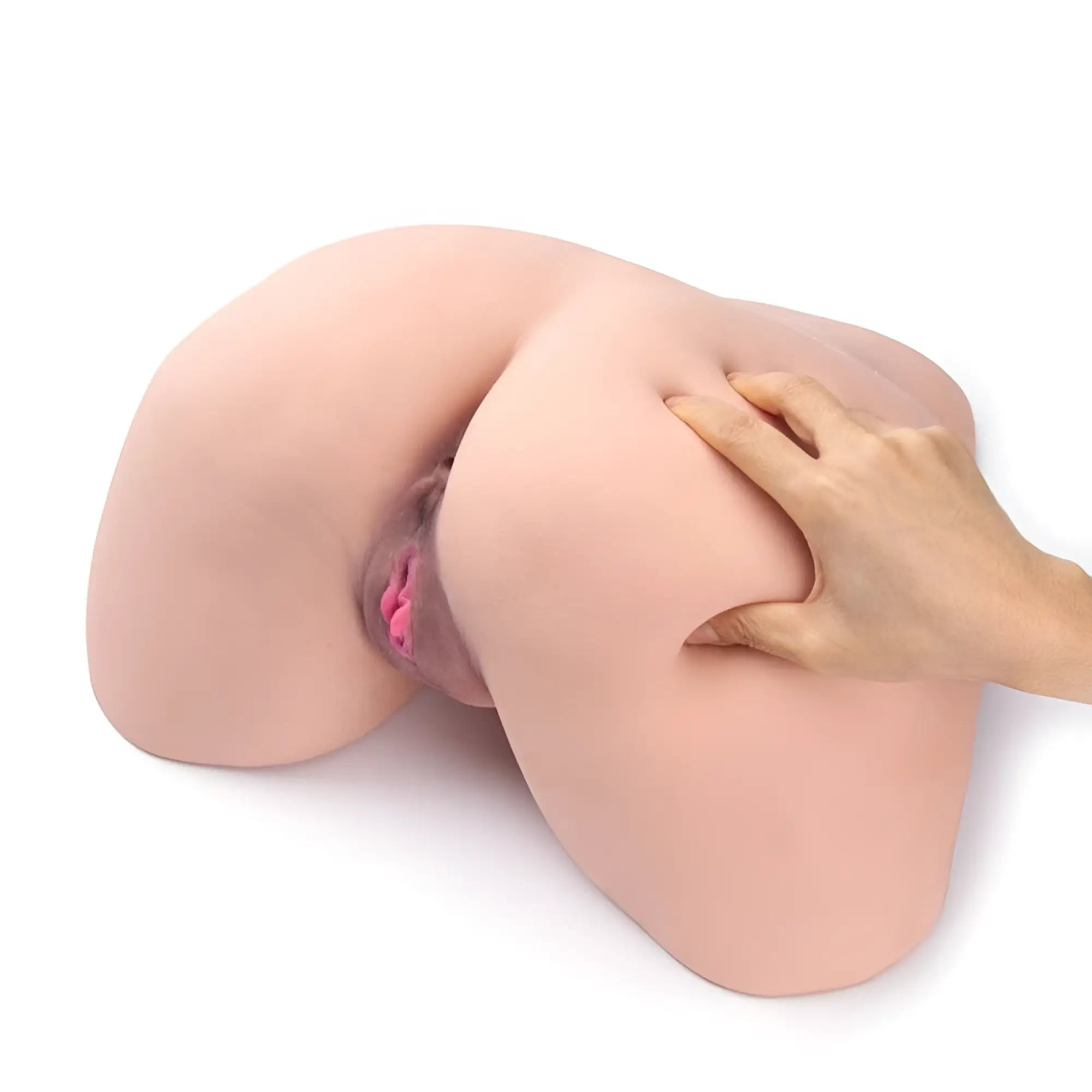 A realistic silicone female genital model with smooth flesh tone and pink internal details in daytona dolls jemma doggy style big butt