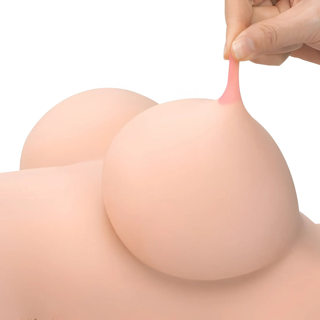 Pink silicone breast-shaped toy with soft realistic texture and smooth surface from daytona dolls love torso helen