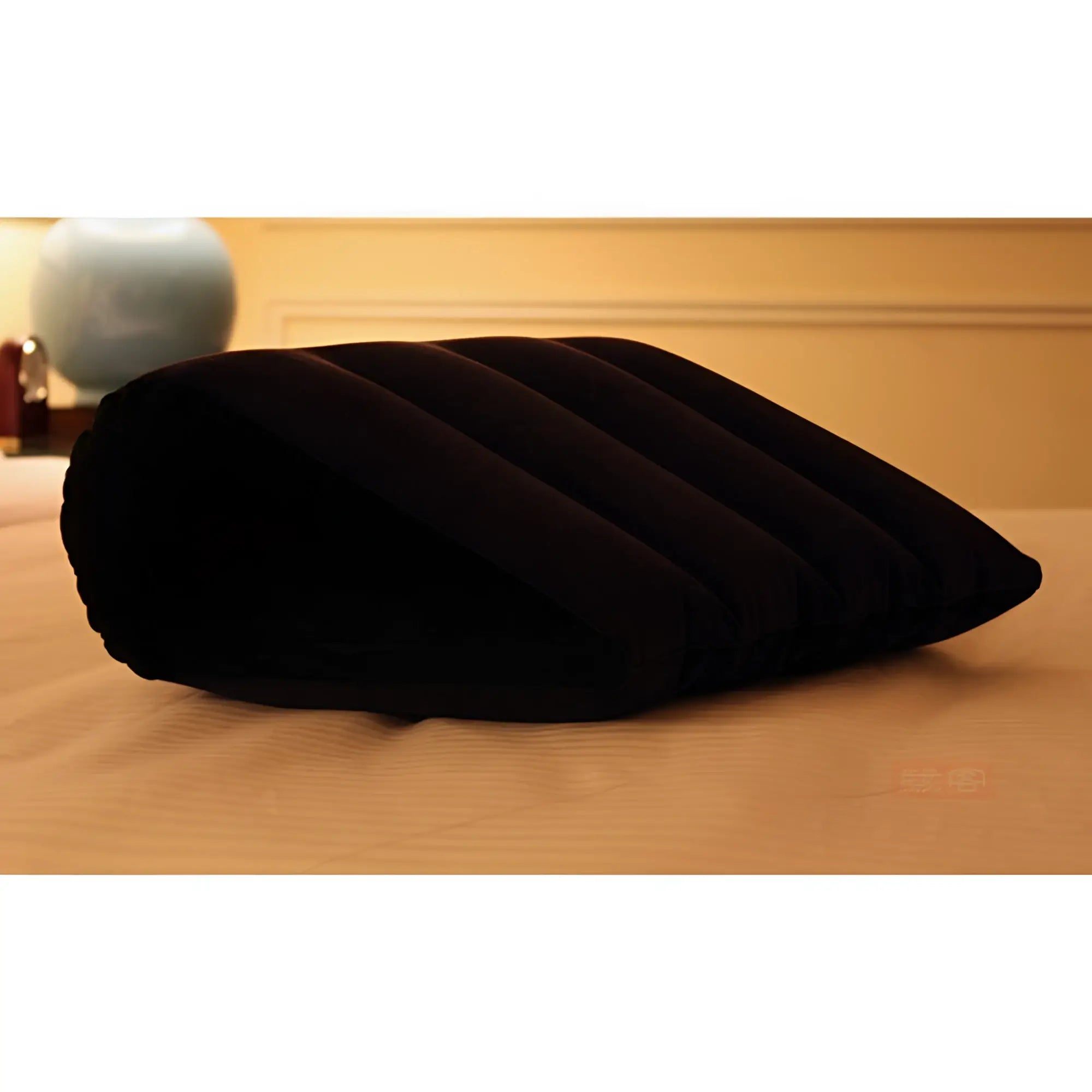 Black inflatable sex positioning wedge pillow with ribbed texture designed for comfort and support by daytona