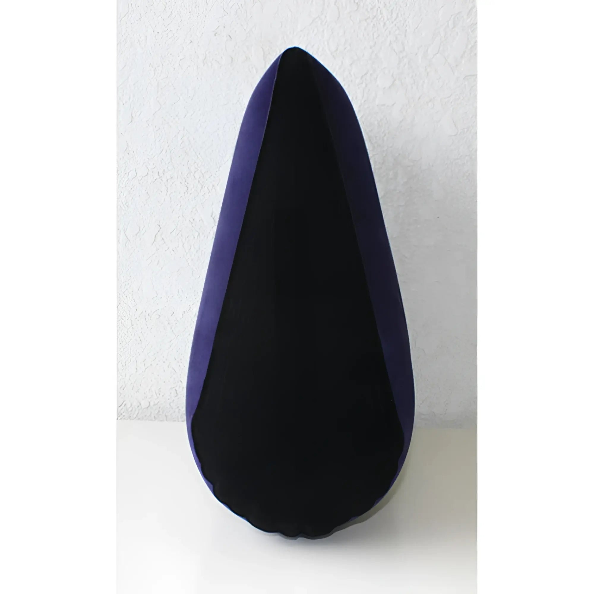 Daytona inflatable sex positioning triangular cushion with plush deep purple fabric and black inner lining in teardrop shape