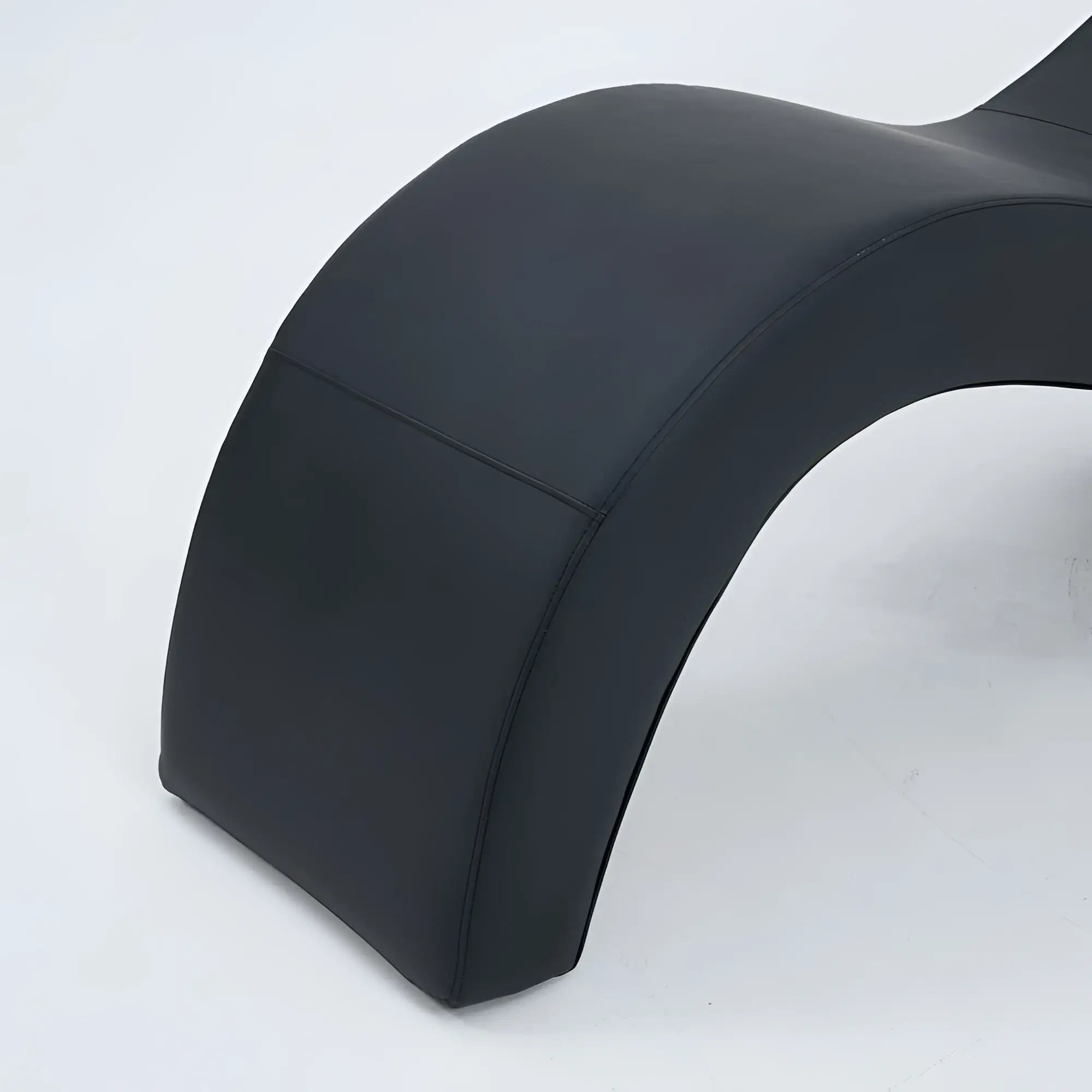 Black leather Daytona Kama Sutra Halo Arc Love Lounge recliner with sleek curved design for comfortable seating