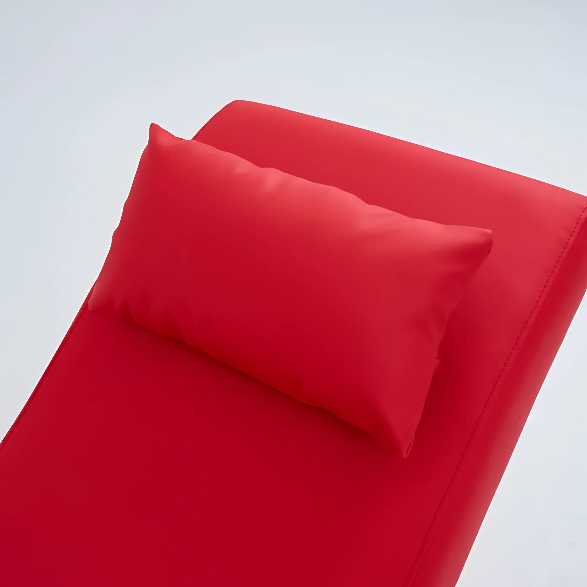 Red cushioned lounge chair with matching pillow from daytona kama sutra halo arc love lounge collection