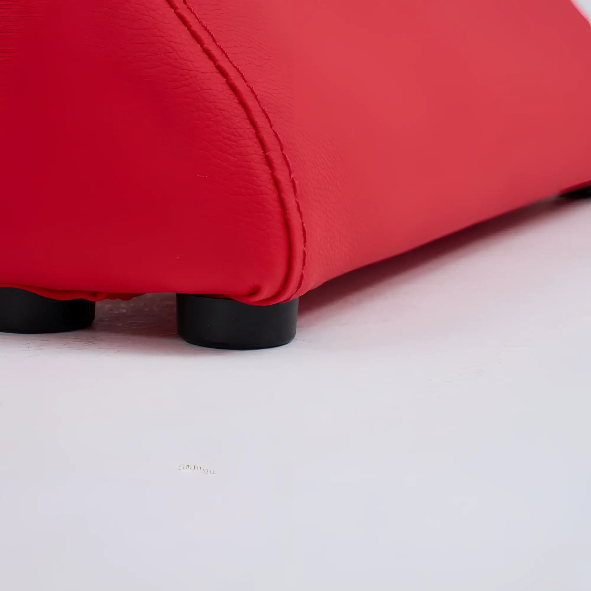 Red leatherette ottoman with black plastic feet from daytona kama sutra halo arc love lounge red collection