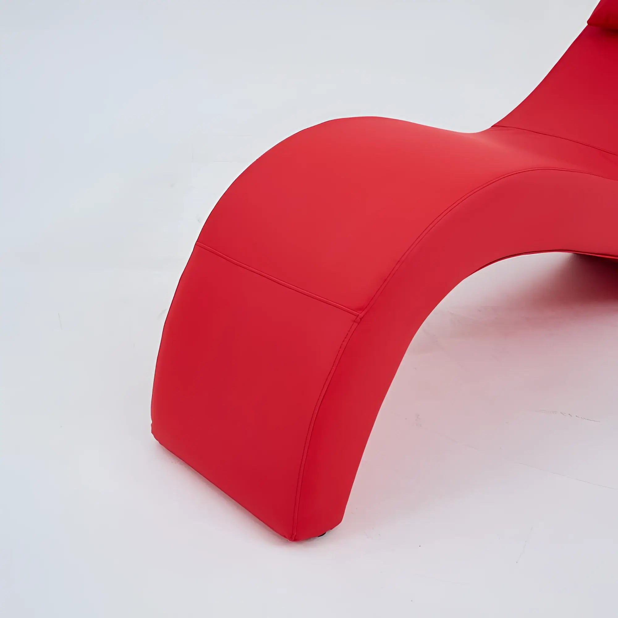 Vibrant red Daytona Kama Sutra Halo Arc love lounge chair with sleek curved design and smooth synthetic leather upholstery
