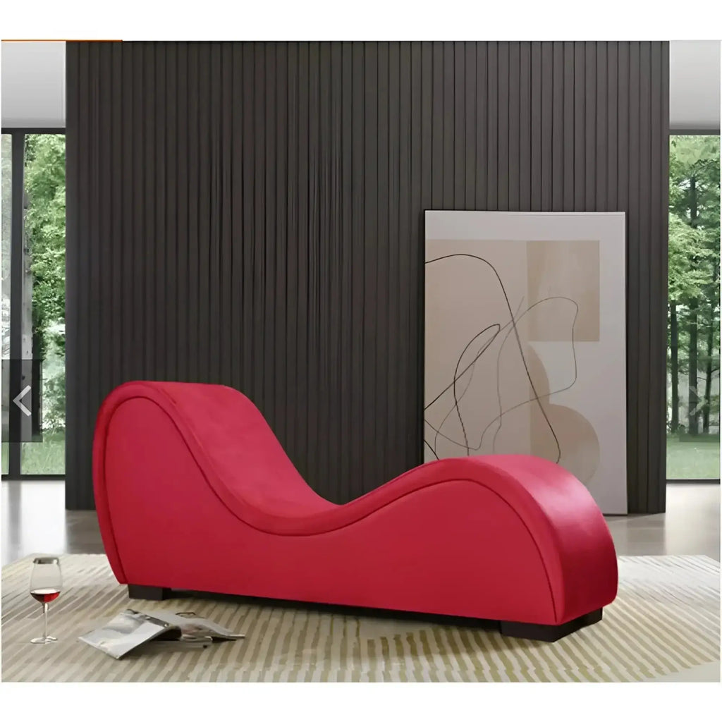 A vibrant red Daytona Kama Sutra Mebon chaise love lounge with sleek curves upholstered in smooth fabric