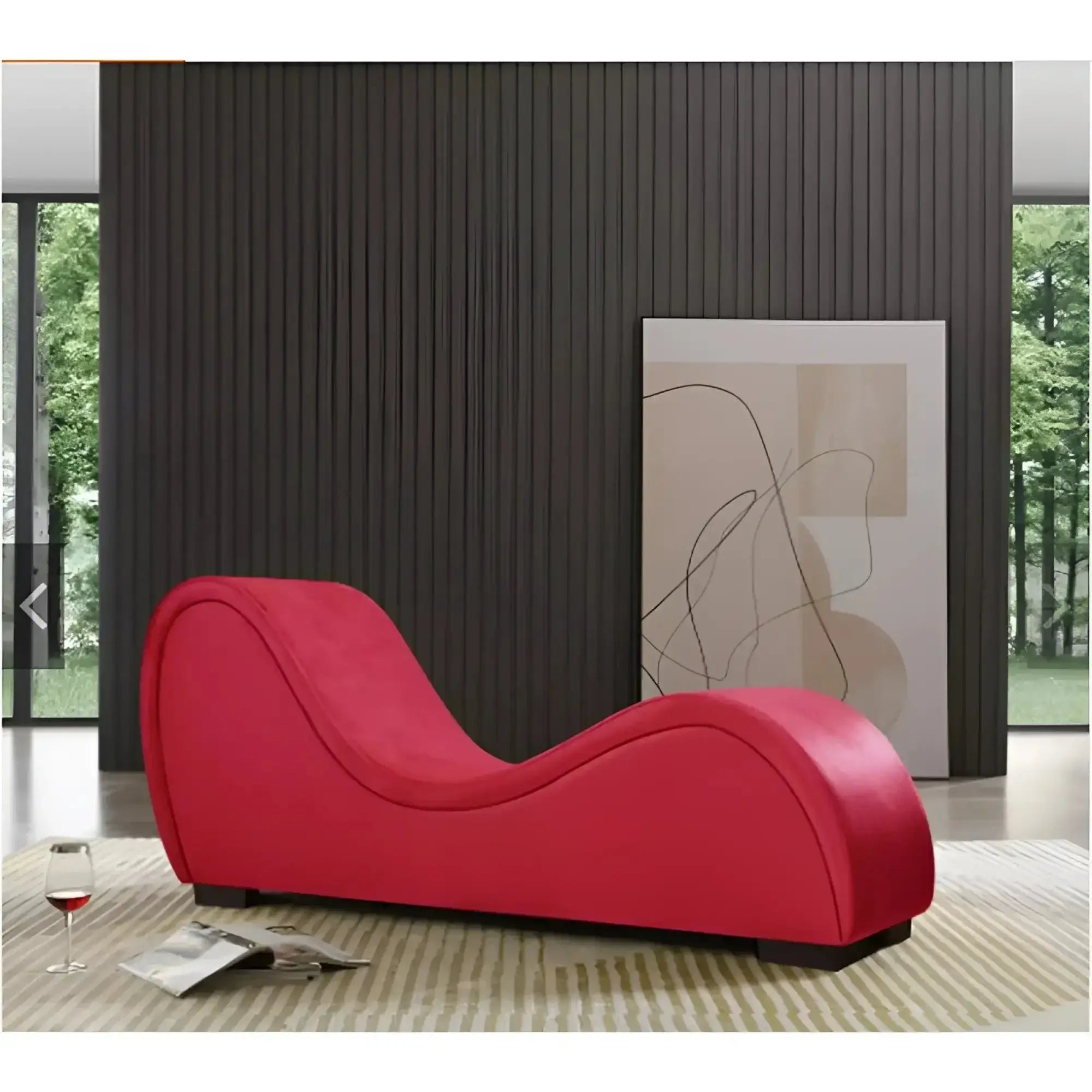 A vibrant red Daytona Kama Sutra Mebon chaise love lounge with sleek curves upholstered in smooth fabric