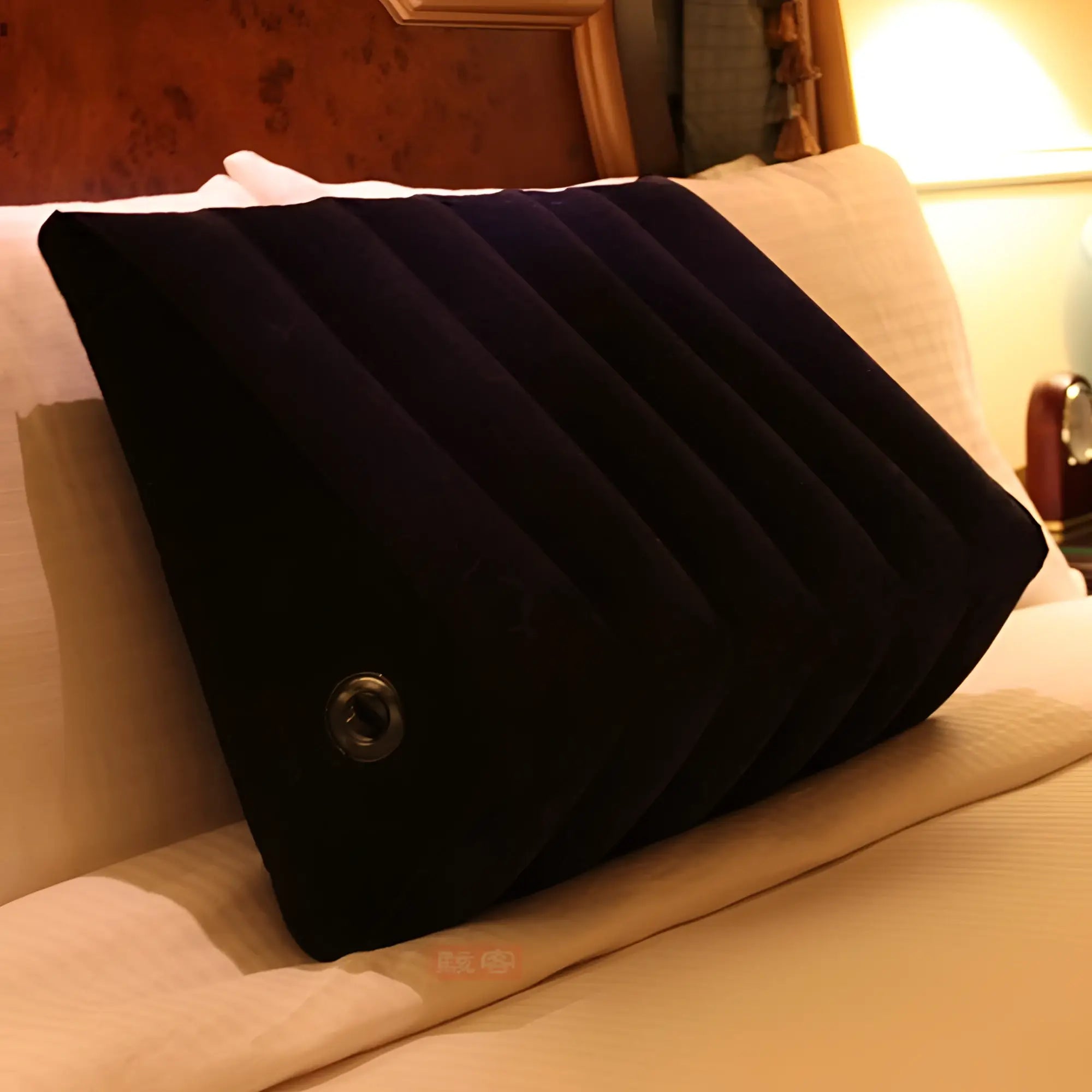 Black inflatable large sex positioning wedge cushion with ribbed texture and circular valve by daytona
